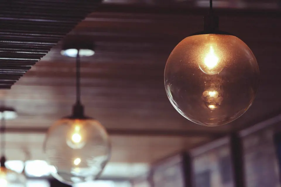 Glass globe pendant lights glowing warmly